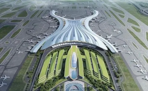 Ảnh sân bay nhìn xa với nhà ga trắng nổi bật giữa nền xanh, các đường băng kéo dài hai bên tạo cảm giác quy mô lớn của cảng hàng không quốc tế Long Thành